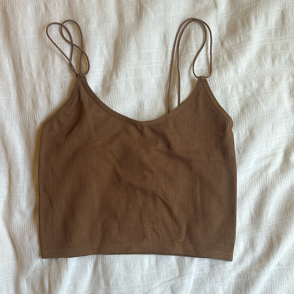BRAND NEW. Brown stretchy cropped spaghetti strapped shirt. Size S/M